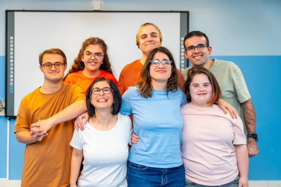 Group of disabled friends all smiling at camera